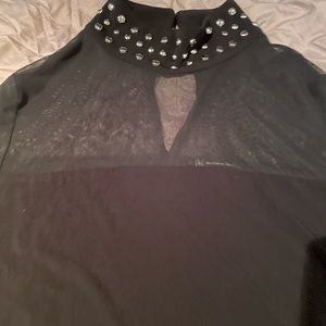 Black studded turtle neck with sheer chest